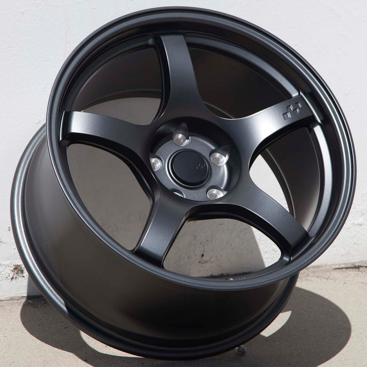 Matte gunmetal 5-spoke alloy Circuit CSF5 wheel with round center cap, front view