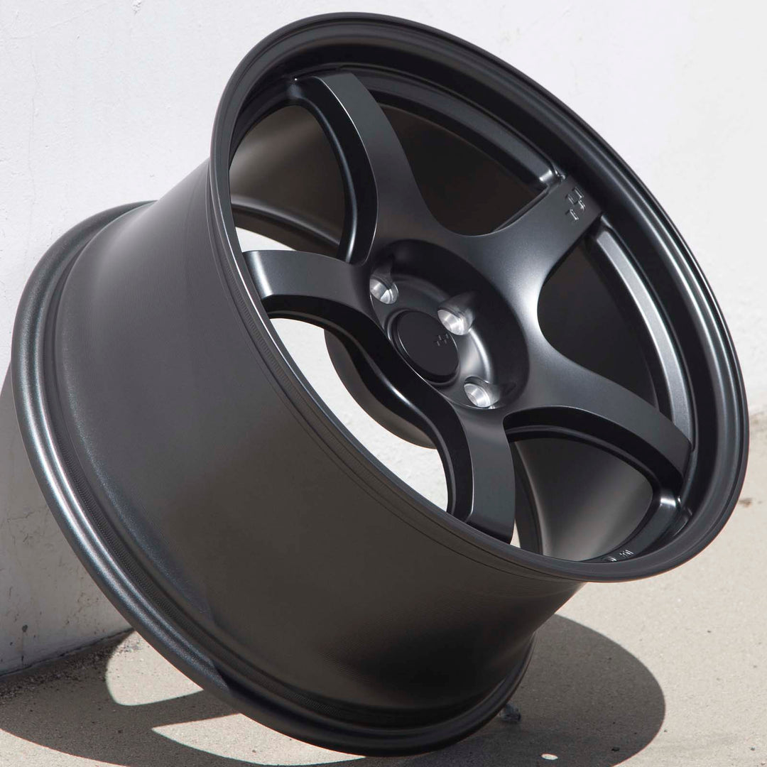 Matte gunmetal 5-spoke alloy Circuit CSF5 wheel, three-quarter view with lug holes visible