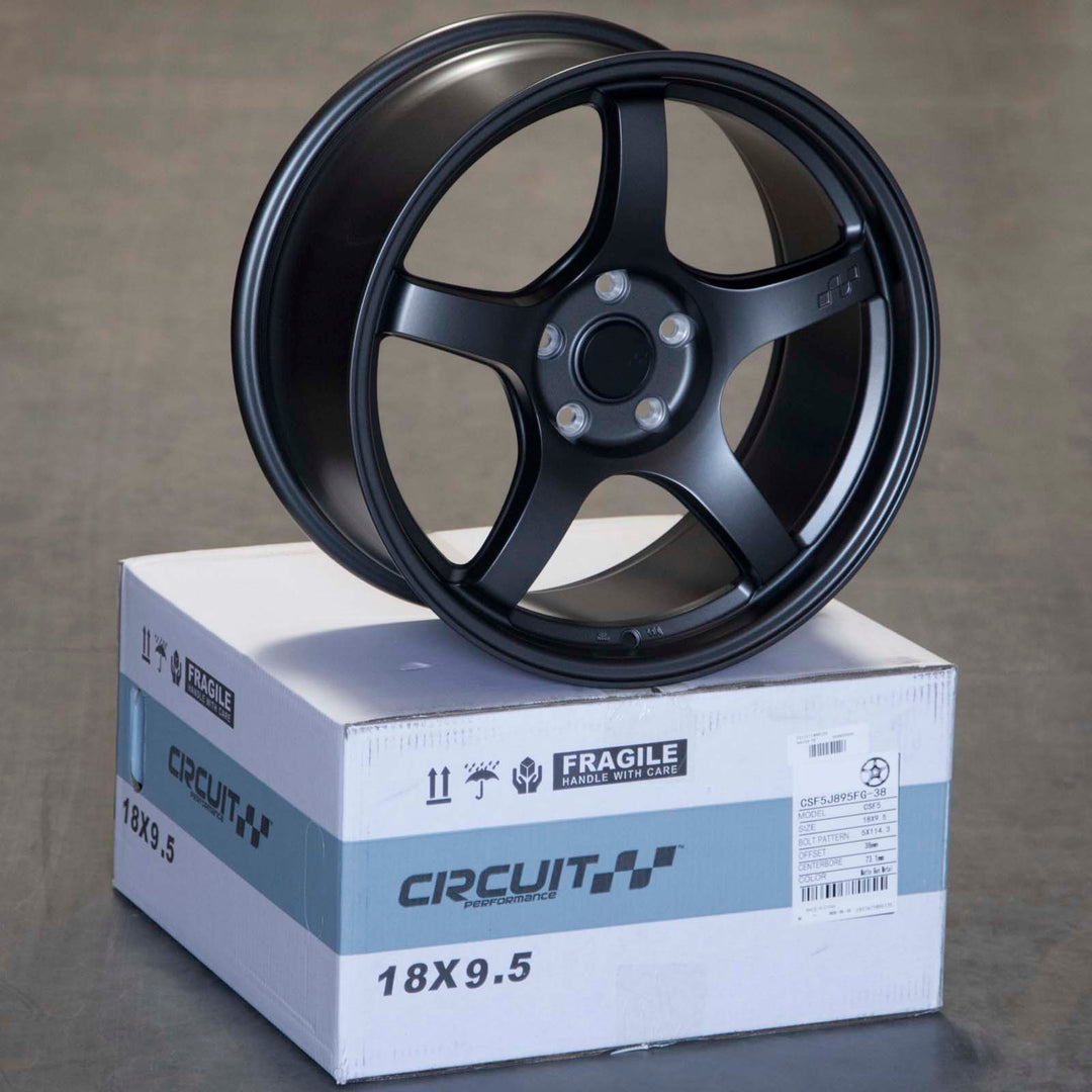 Matte gunmetal alloy Circuit CSF5 wheel, dark 5-spoke design with center cap and lug holes