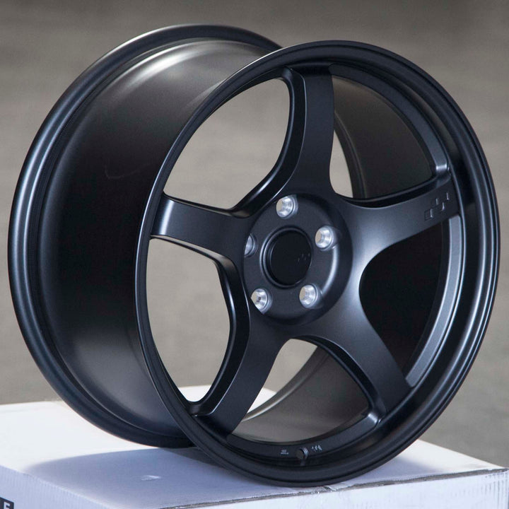 Matte gunmetal alloy Circuit CSF5 wheel side view, dark 5-spoke rim with center cap