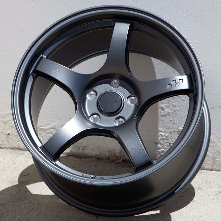 Matte gunmetal alloy Circuit CSF5 wheel close-up, five spokes with lug bolt holes and center cap